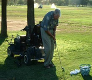 An older adult plays golf.
