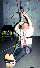 Man with a spinal cord injury is rock climbing