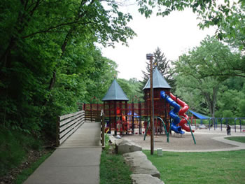 Example of an accessible playground with wooden boardwalk/ramp.