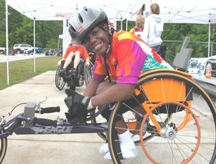 A youth in his racing wheelchair.