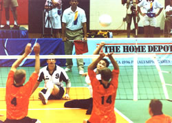 Photo of a seated vollyball game in play