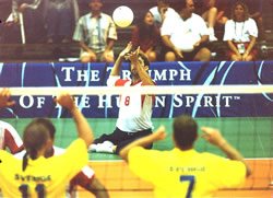 Photo of a sitting vollyball player about to serve