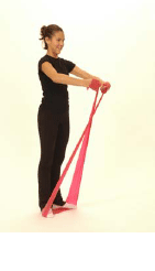 A girl doing a Front Raise using a Thera-Band.