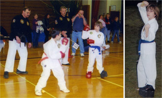 Picture of kids in a karate match with onlookers cheering them on