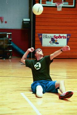 Blazesports athlete playing seated volleyball